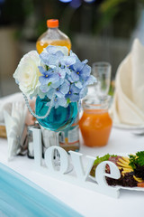 wooden word love on wedding table