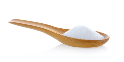 Salt in wooden spoon on white background