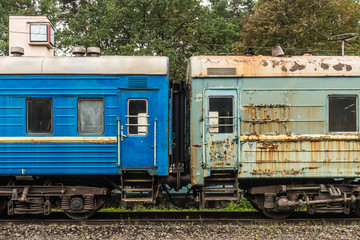 Fototapeta na wymiar Abandoned soviet era trains in a railroad yard in Ukraine.