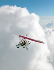 The motor hang-gliding in the sky near the himalayan peaks Machhapuchhare - Nepal