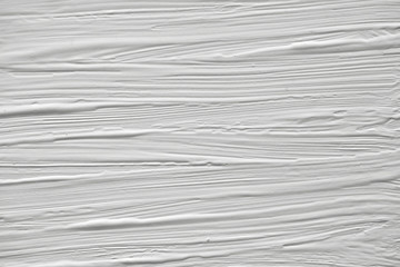 The texture of the paint on a white background. Gouache on canvas stripes.