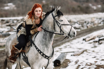 Fototapeta na wymiar Viking girl on horseback