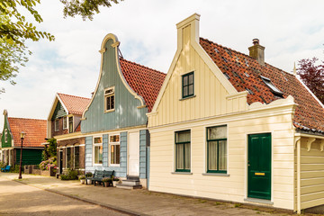 Fototapeta na wymiar Classic old wooden Dutch houses in North Amsterdam