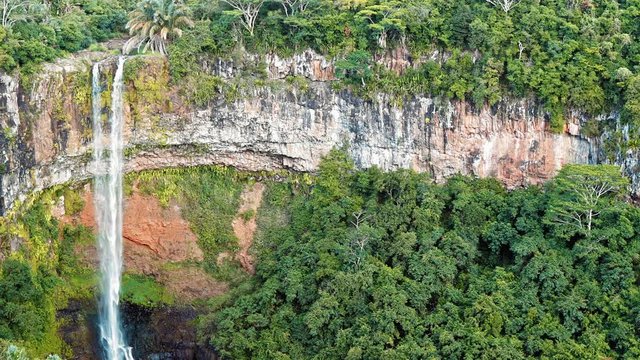 Waterfall in the jungles panorama view slow motion. Scenic Chamarel waterfall. Mauritius island