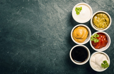 Obraz na płótnie Canvas bowls of various dip sauces