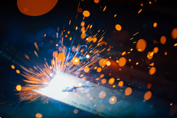 artistic welding sparks light, industrial background