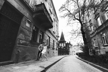 cute romantic gentle beautiful redhead stylish girl and her boyfriend spend good time in lviv