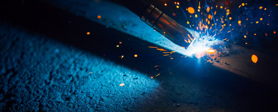 artistic welding sparks light, industrial background