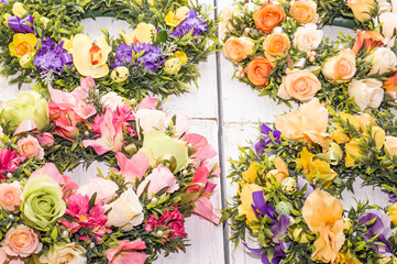 Background for easter, card with eggs and flowers on white table, home decor