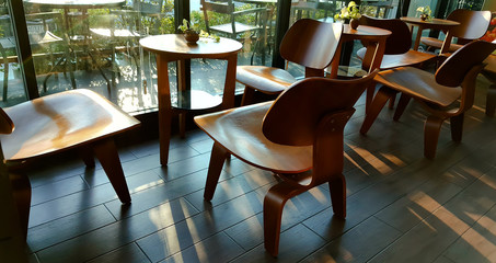 Street view of a coffee terrace with tables and chairs