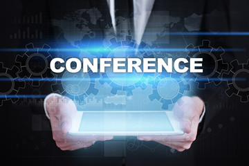 Fototapeta na wymiar Businessman holding tablet PC with conference concept.