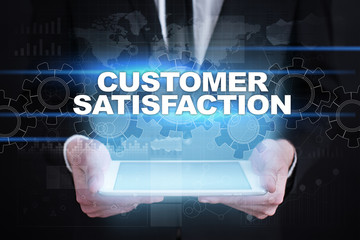 Fototapeta na wymiar Businessman holding tablet PC with customer satisfaction concept.