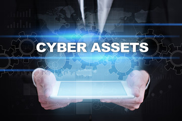 Businessman holding tablet PC with cyber assets concept.
