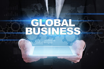 Fototapeta na wymiar Businessman holding tablet PC with global business concept.