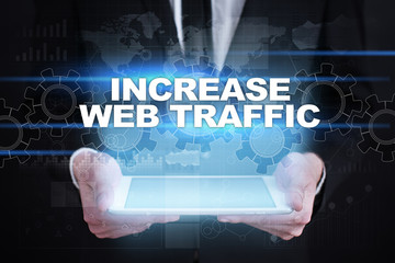 Fototapeta na wymiar Businessman holding tablet PC with increase web traffic concept.