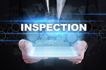 Businessman holding tablet PC with inspection concept.