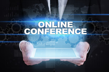 Businessman holding tablet PC with online conference concept.