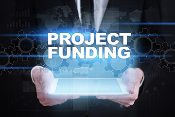 Fototapeta na wymiar Businessman holding tablet PC with project funding concept.