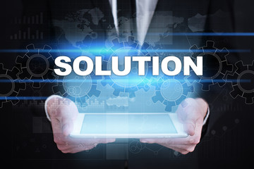 Businessman holding tablet PC with solution concept.