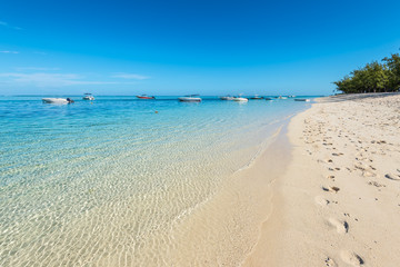 Sand and blue ocean in the Le Morne Beach Mauritius Island