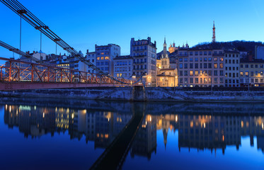 Illuminated bridge, Passerelle Saint-Vincent, over the Saone river in Lyon, France.
