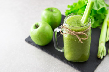 Blended green smoothie with ingredients. Superfood, detox and healthy concept. selective focus