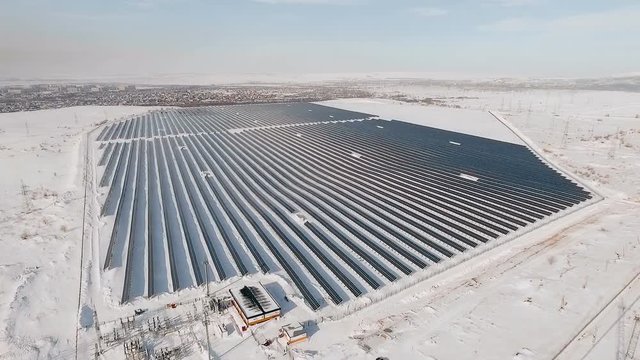 aerial solar farm winter flight