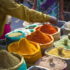Foto auf Leinwand Colorful spices powders and herbs in traditional street market in Delhi. India. © Curioso.Photography