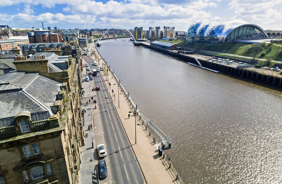 Aerial view of pedestrians walking alone Newcastle Quayside.