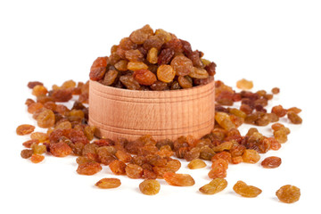 raisins in a wooden bowl isolated on white background