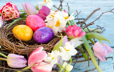 Happy Easter: nest with Easter eggs, feathers, tulips and daffodils:)
- 138713170