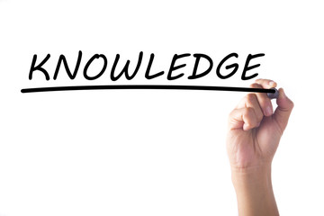 Hand writing KNOWLEDGE on transparent board