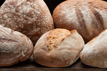 Bread arranged on wooden table