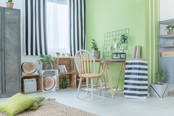 Green room with striped accessories