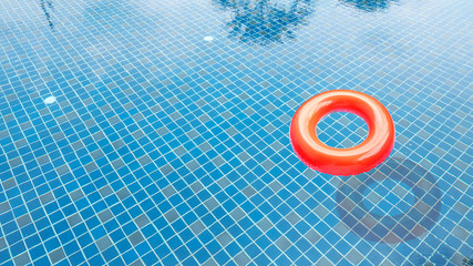 Red swim ring in the swimming pool.