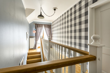 Staircase hallway with wooden balustrade