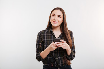 Pensive Smiling Woman in shirt with phone