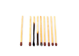 Laid used matchsticks isolated on white background
