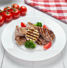 Assorted Meat Grill. Delicious fried pieces of beef medium rare and appetizing pieces of pork. Close up