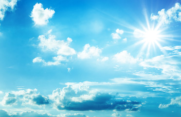 Naklejka na ściany i meble blue sky sun clouds background
