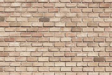 Old beige brick wall background texture