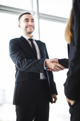 Business people shaking hands in office