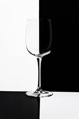 empty glass of wine on black and white background