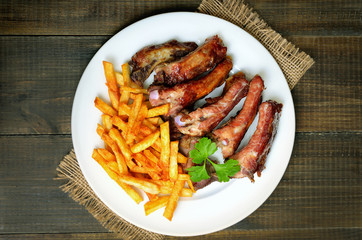 Grilled sliced pork ribs and french fries