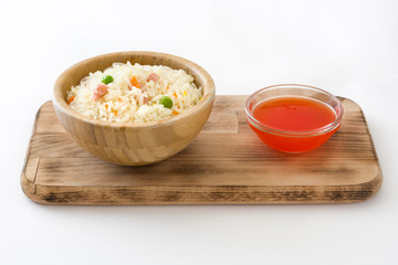 Fried chinese rice with vegetables isolated on white background