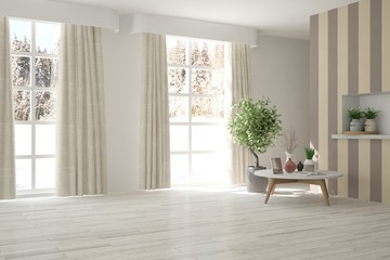 White empty room with winter landscape in window. Scandinavian interior design
