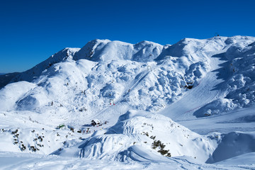 Ski slopes on snow capped mountain