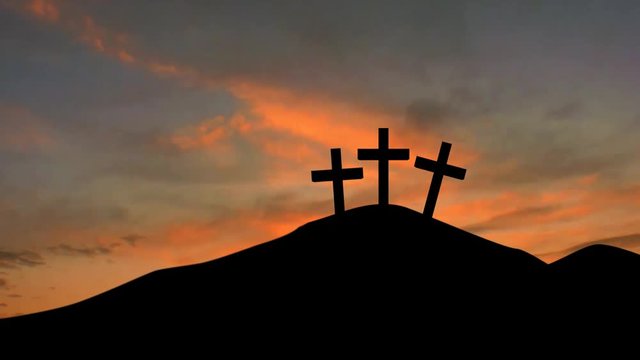 Silhouette of three christian cross on the mountain peak with red sunrise sky