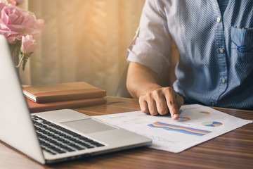 Businessman at work. Man working on laptop while sitting at the wooden desk   Stock photo ID: 589816190