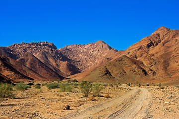 Desolate Valley with Red Hills